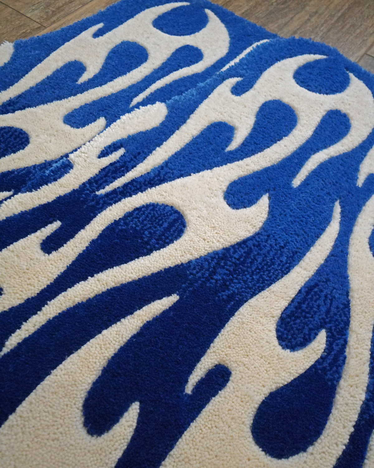Pair of hand-made car floor mats featuring a vibrant flame design in blue gradient and white tribal flames, with a retro-inspired aesthetic.