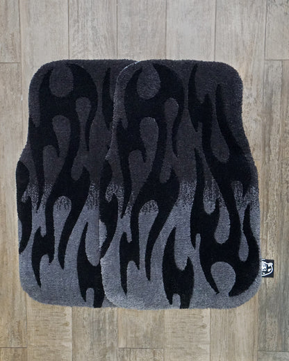 Pair of hand-made car floor mats featuring a vibrant flame design in gray gradient and black tribal flames, with a retro-inspired aesthetic.