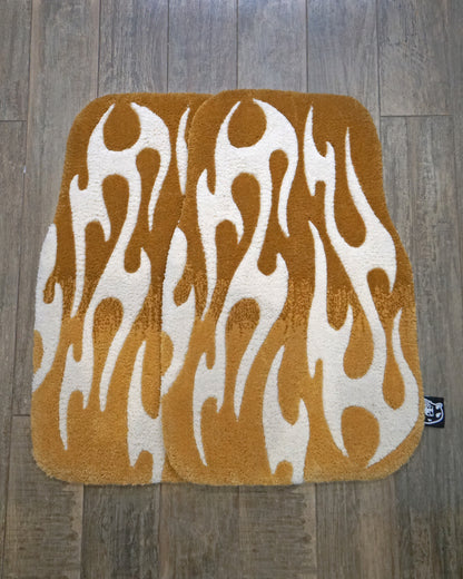 Pair of hand-made car floor mats featuring a vibrant flame design in gray gradient and black tribal flames, with a retro-inspired aesthetic.